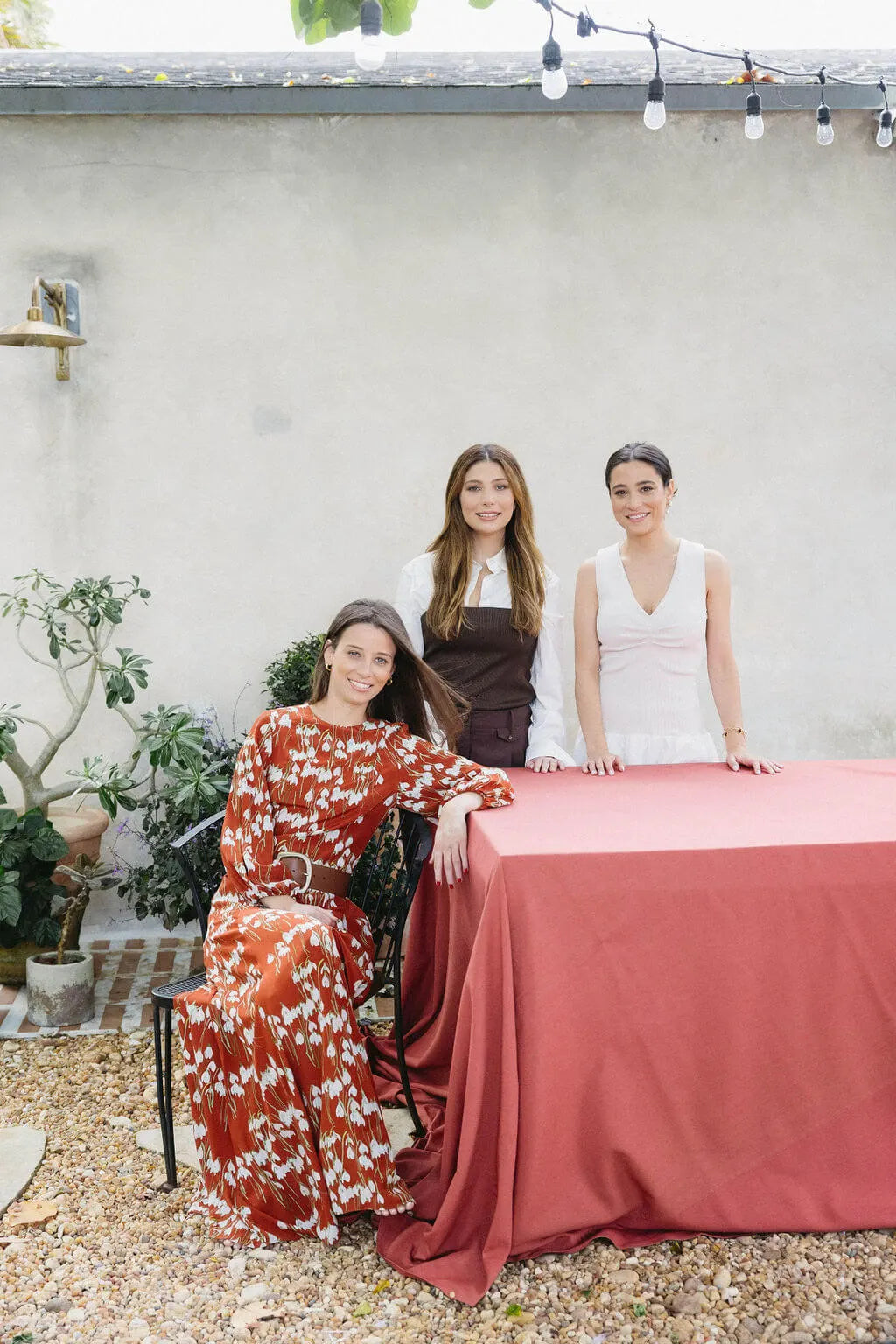 Stephanie, Vanessa, and Ilana gathered around a table