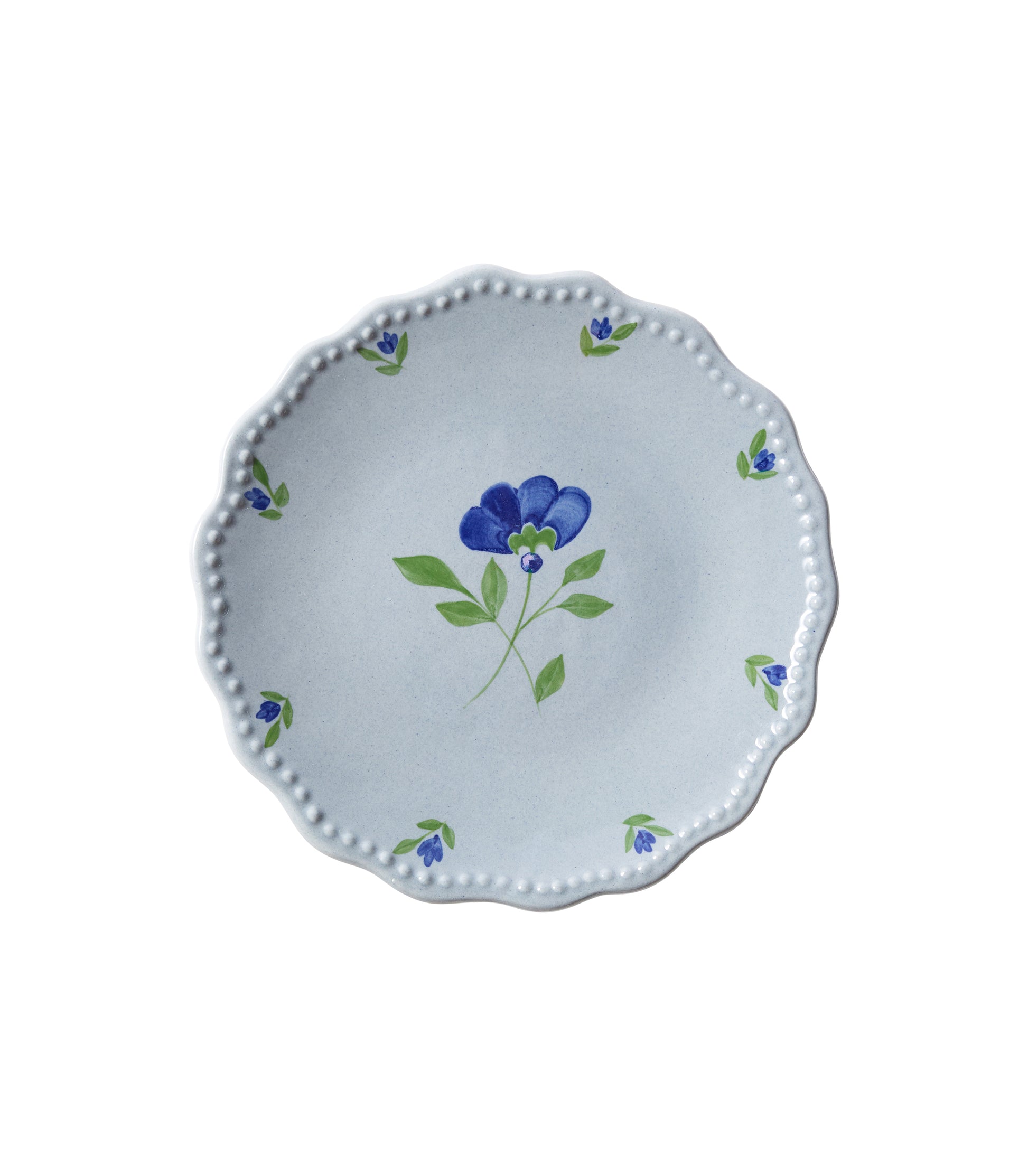 Blue ceramic side plate with central flower and edge floral design.