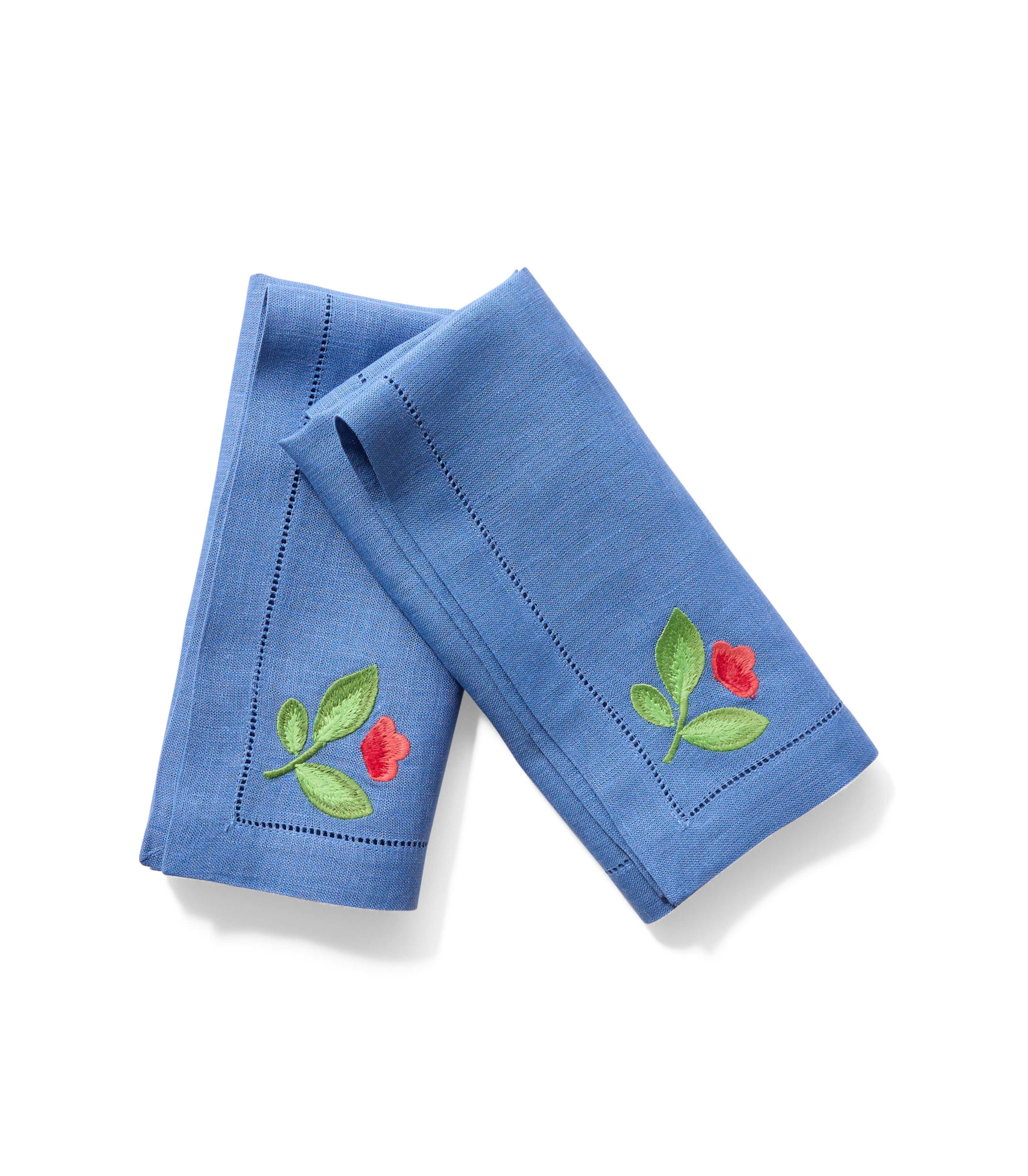 Blue linen dinner napkin with red and green floral corner embroidery.