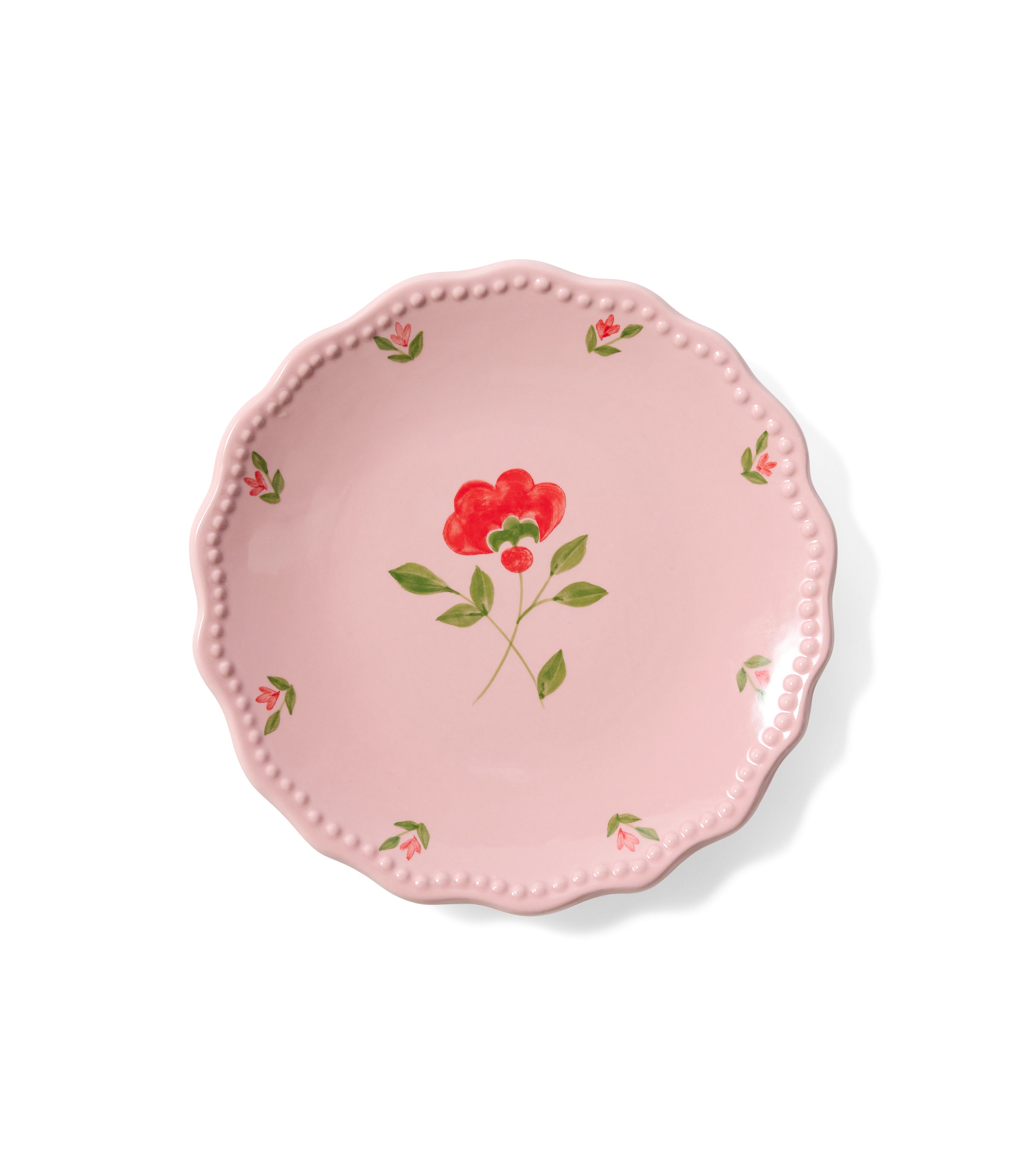 Pink ceramic side plate with central flower and edge floral design.