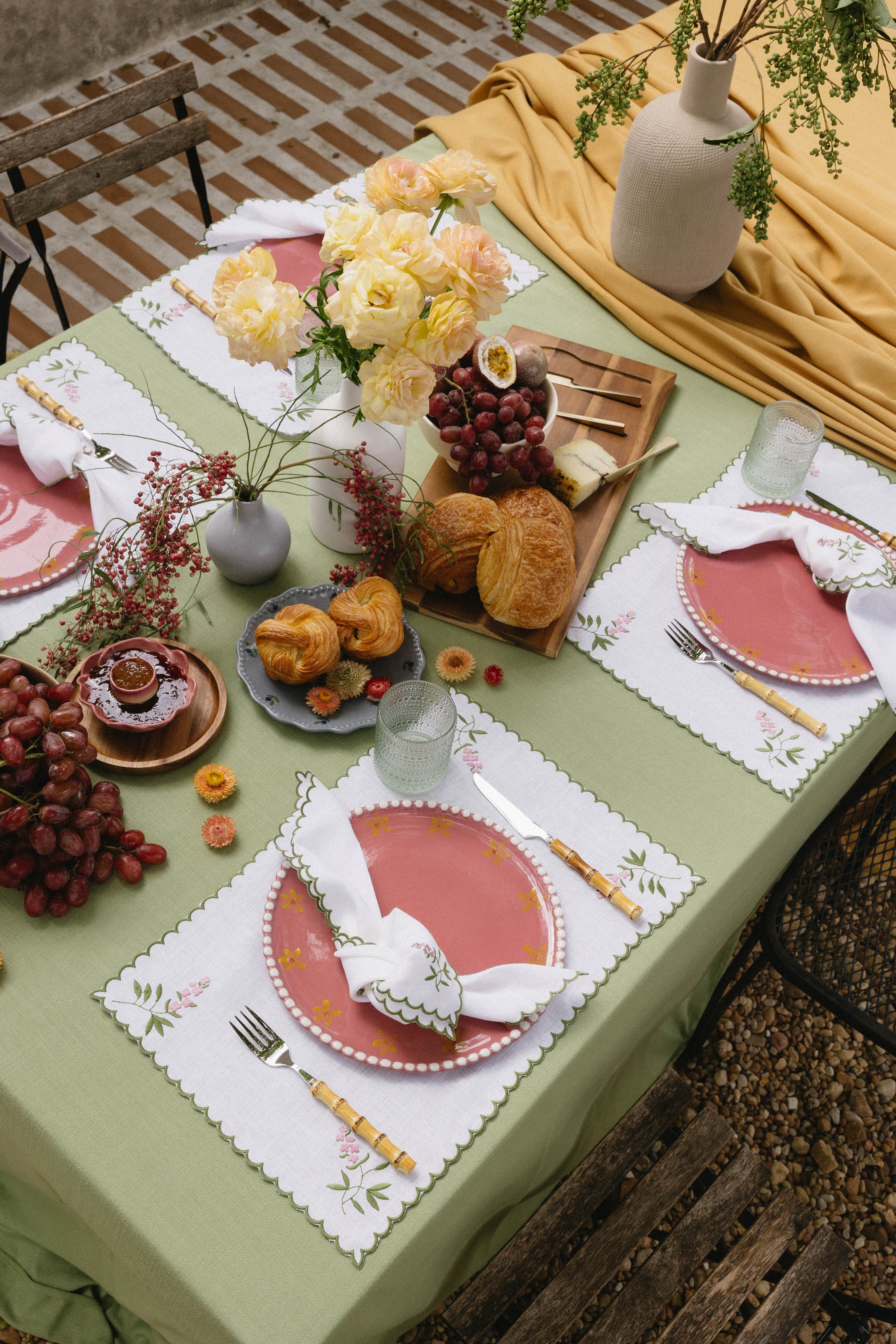 Jardin Collection embroidered linen placemats and ceramics styled on dining table