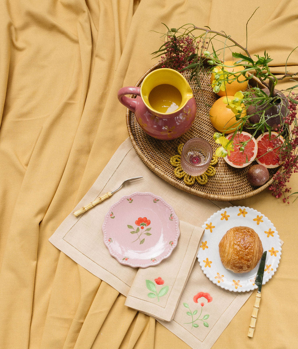 Linen placemat and napkin with flower embroidery with pink pitcher and drink coaster