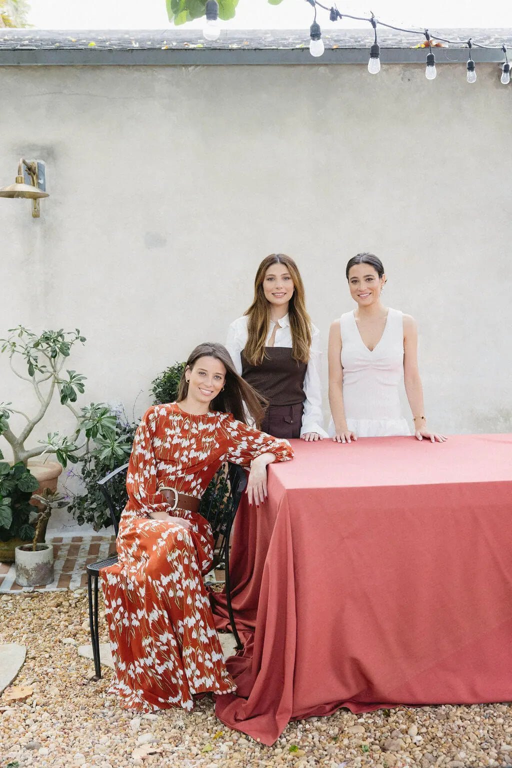 Stephanie, Vanessa, and Ilana gathered around a table